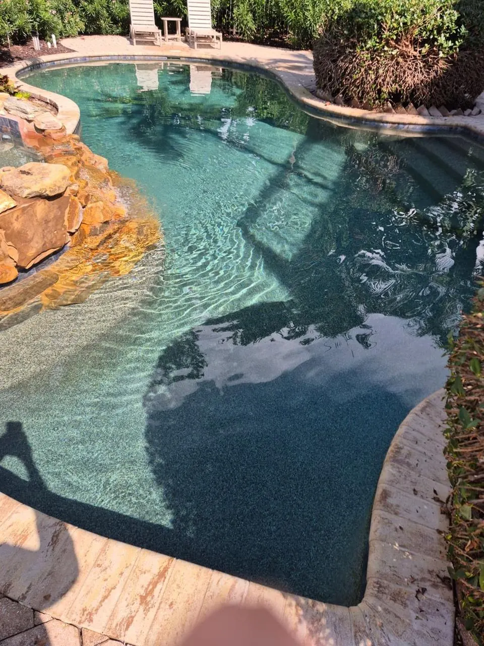 Lagoon-style pool with waterfall rocks